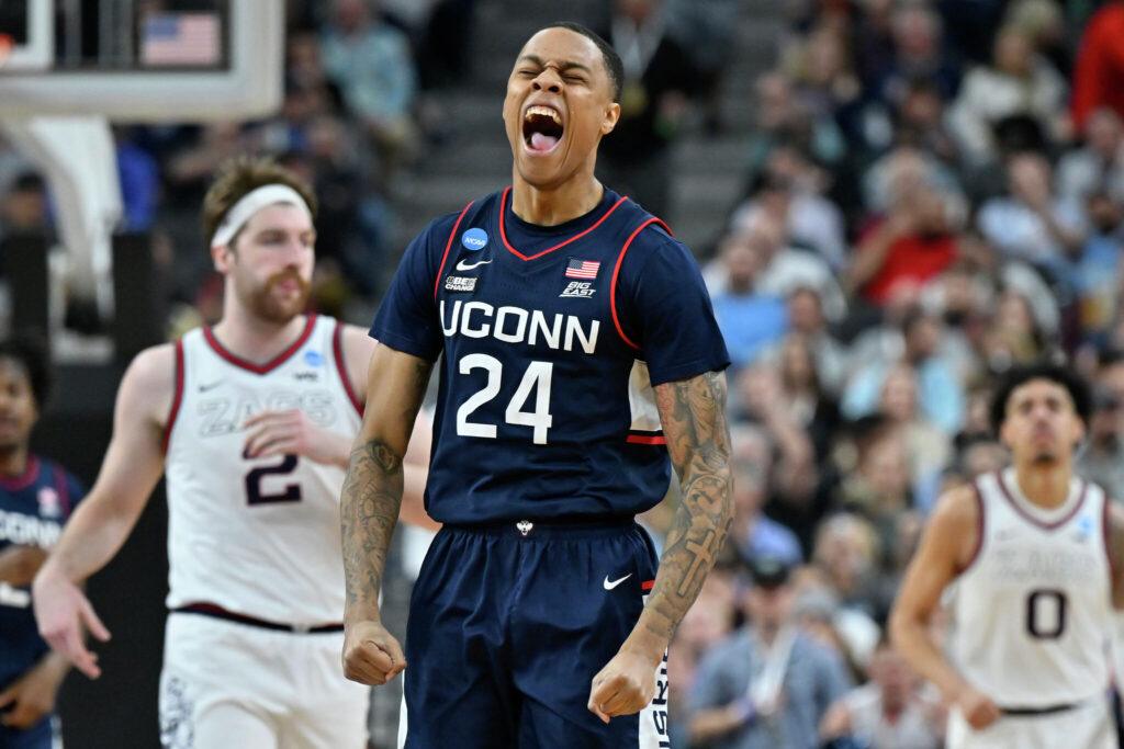 UConn basketball player wearing number 24 celebrating during a game