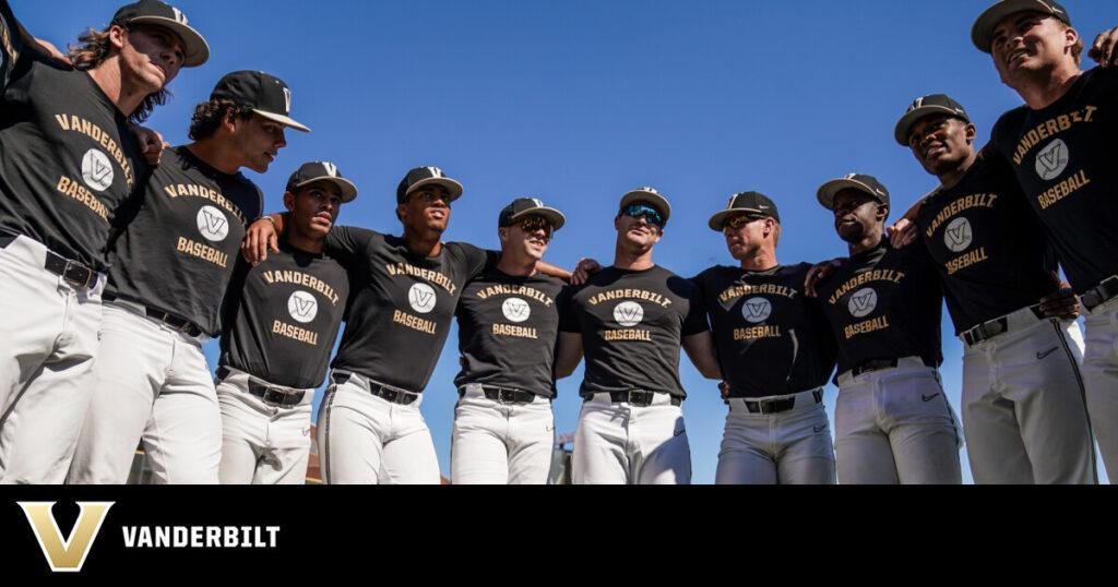 Baseball players wearing Vanderbilt shirts posing together outdoors